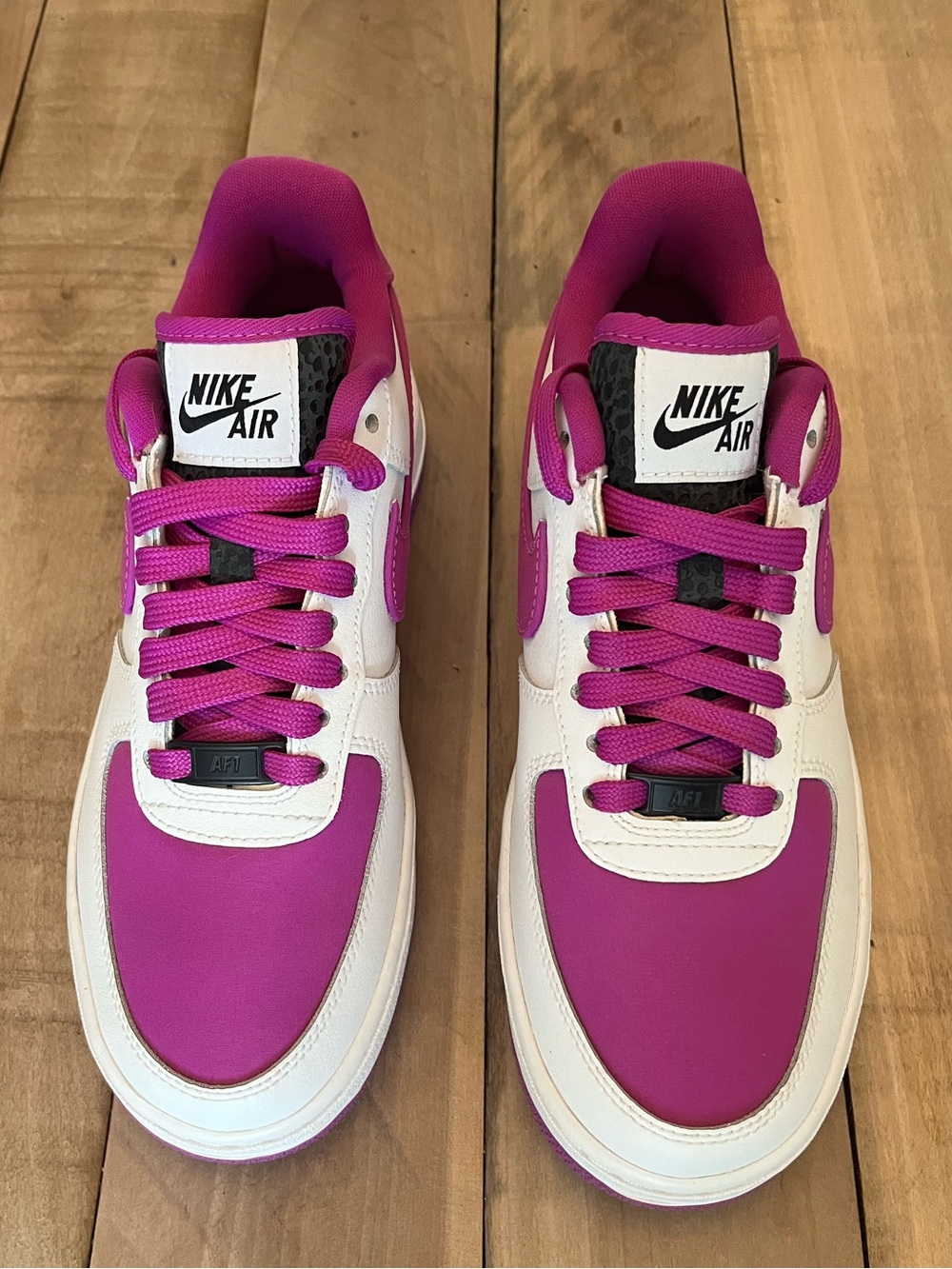 Nike Women’s Low-Top Sneakers in Magenta and White